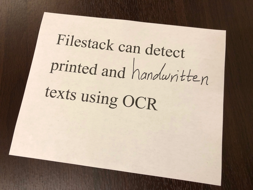 Photo of a printed message explaining that Filestack’s OCR can detect both printed and handwritten text from images.
