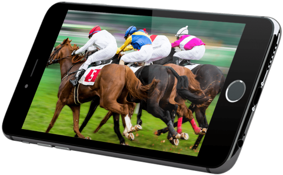 A smartphone displays an image of four jockeys riding horses in a race, giving the illusion that the horses are emerging from the screen.